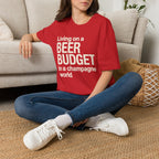 Living on a Beer Budget In A Champagne World T‑Shirt