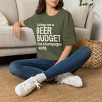 Living on a Beer Budget In A Champagne World T‑Shirt