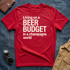 Living on a Beer Budget In A Champagne World T‑Shirt